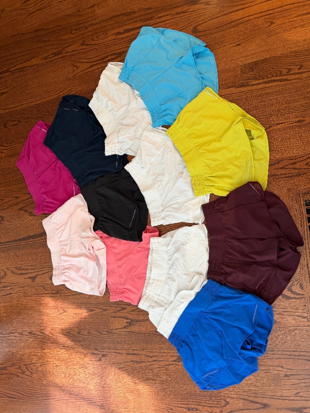 12 pairs of Lululemon Hotty Hot high rise, lined 2.5" shorts in assorted colors